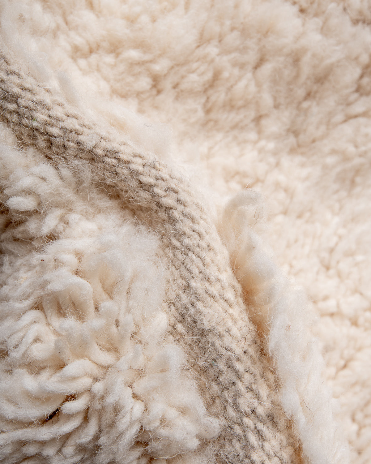 Modern, designer, handcrafted Berber rug from Morocco. Beniourain carpet with minimalist design, natural wool pile and a fluffy texture.